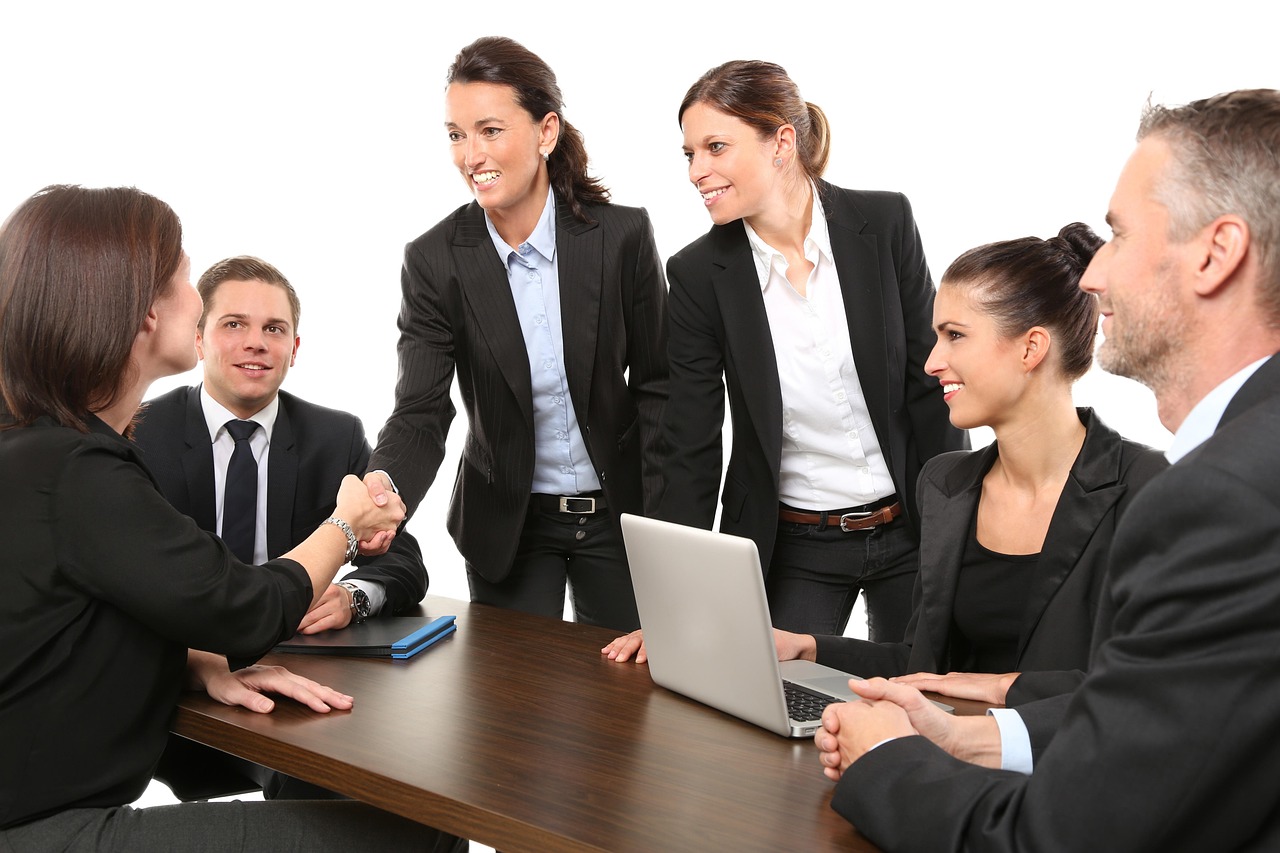 Gene Corp account team greeting a client